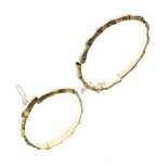 Two broken 9ct gold snap bangles, 20g approx Condition: