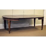 Early 20th Century mahogany oval extending dining table fitted three insertions and standing on