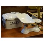 Vintage white enamel cake bin together with a pair of similar kitchen scales Condition: