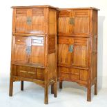 Pair of Chinese tall cabinets, each having four doors with bamboo panels, sliding doors below and
