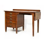 Oak single pedestal office desk fitted five drawers, a fall flap to one end Condition: