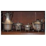 Early 20th Century hammered pewter four piece tea service comprising: teapot, hot water jug, cream