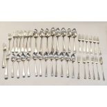 Large selection of silver flatware comprising: twelve dessert forks and spoons, eight tablespoons