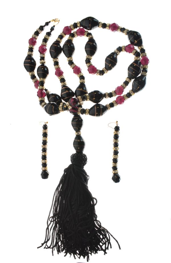 Flapper style black glass and paste necklace, together with a pair of similar earrings Condition: