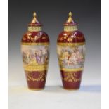 Pair of early 20th Century Royal Vienna style vases, each of slender ovoid form, having a continuous