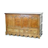 18th Century oak mule chest, the front with four arch shaped fielded panels, three drawers below and