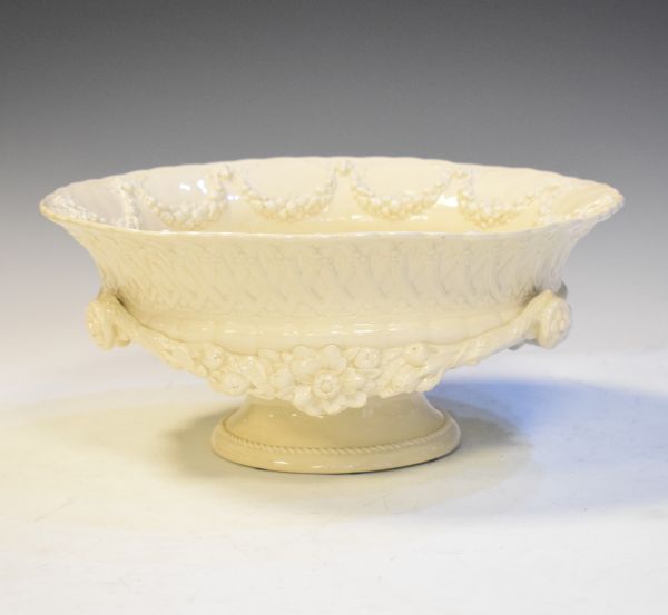 Wedgwood creamware bowl decorated in the Coalport style with floral swags in relief Condition:
