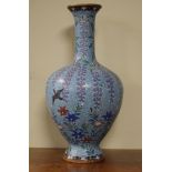 Japanese cloisonné baluster vase, Meiji period, decorated with birds amongst trailing foliage on a