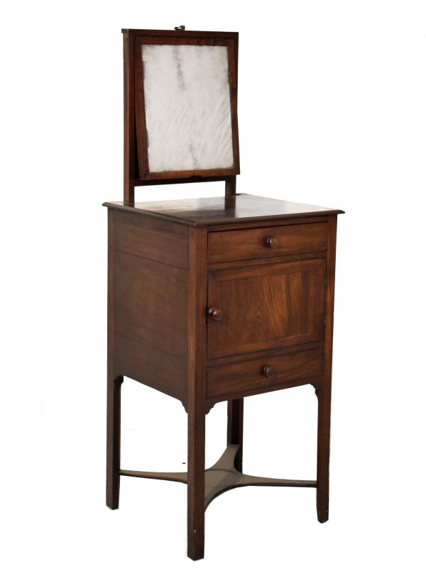 George III mahogany dressing stand having a concealed adjustable mirror, fitted drawer with a