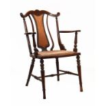 Edwardian beech open arm occasional chair having a stuffed seat and standing on turned supports