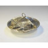 George V silver entrée dish of circular design with four divisions framing ring carry handle,