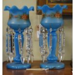 Pair of late 19th/early 20th Century blue glass lustre drop vases, each having floral decoration