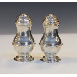 Pair of George V Britannia standard silver salt and pepper casters, London 1928, 4.1oz approx, in