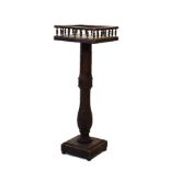 Carved torchère having a square gallery top and standing on a conforming base Condition: