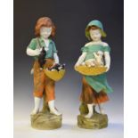 Pair of 1930's period painted plaster figures depicting a young girl with puppies and a young boy