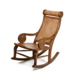 Pair of modern Eastern rocking chairs, each having a rattan seat and back Condition: