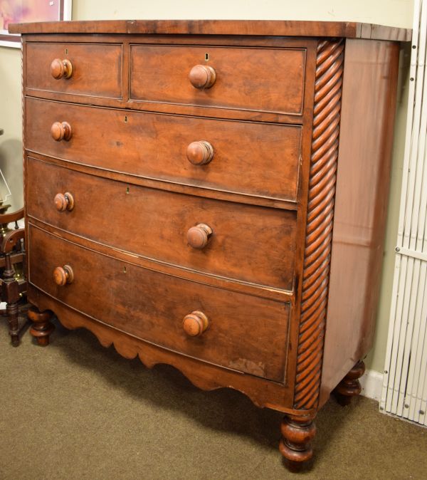 Early 19th Century mahogany bow front chest of two over three drawers with reeded columns on