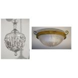 Two glass ceiling lights, the first of hemispherical bowl form with brass rim and hooks, the