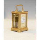 Miniature French brass cased carriage clock, the off-white dial with Roman and Arabic numerals