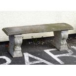 Reconstituted stone garden bench on scroll supports Condition: