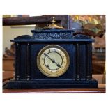 Late 19th Century black painted mantel clock simulating black slate, the Arabic dial with two