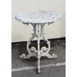 White painted metal circular top garden table on three foliate scroll supports Condition: