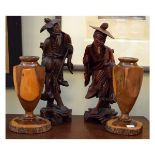 Pair of Oriental carved root wood figures of pedlars together with pair of 20th Century treen