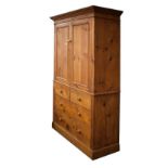 Late 19th Century stained pine two stage linen press with moulded cornice over twin doors