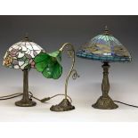 Three Tiffany style coloured glass and metal table lamps Condition: