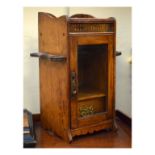 Edwardian oak smokers cabinet with glazed door and pipe racks Condition: