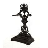 Black painted cast iron stick stand of pierced foliate design with removable tray Condition: