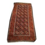 Middle Eastern rug decorated with a central medallion on a red ground within multi borders, 156cm