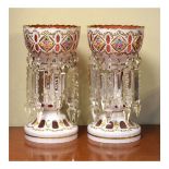 Pair of pink and white overlay lustre drop vases, each having painted floral decoration Condition: