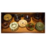 Eleven various pottery spittoons, to include five of treacle glazed design, one of green and brown