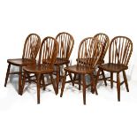 Six early 20th Century ash and elm hoop back Windsor style armchairs Condition: