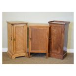 Three assorted bedside cabinets comprising: late Victorian inlaid ash example with panelled door,