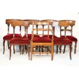 Set of four William IV mahogany yoke back dining chairs, each having a stuffed seat and standing