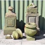 Two weathered marble garden urns on associated stone ware socle and square pedestals Condition:
