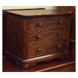 Victorian mahogany miniature chest of three long drawers on shaped apron Condition: