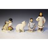 Four Lomonosov porcelain figures, three depicting Eskimo children, the fourth a Polar Bear
