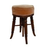 19th Century mahogany revolving music stool, the stuffed circular top upholstered in pink dralon,