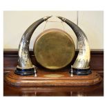 Early 20th Century table top dinner gong, the gong with nickel plated mounted cow-horn supports,