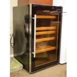 Sandstrom refrigerator wine cooler in black finish with glazed door enclosing wooden shelves