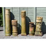 Five assorted stone ware chimney pots to include; a six pointed crown example and two others with