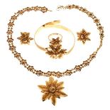 Suite of unmarked yellow metal jewellery comprising necklace, bracelet, earrings and ring, each