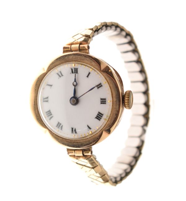 Lady's vintage 9ct gold cased wristwatch, the white enamel dial with Roman numerals, on a steel