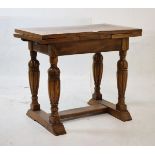 Early 20th Century oak stool in the form of a miniature draw-out dining table, the cleated