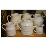 Seven assorted pottery milk jugs Condition: