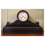 Late Victorian black slate and simulated red marble cased mantel clock, the white enamel dial with