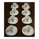 Set of eight Limoges coffee cans and saucers, each having botanic decoration Condition: